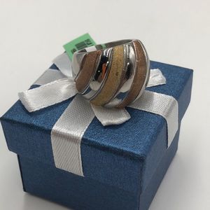 3-toned silver/gold/bronze ring size 7. Comes in gift box.